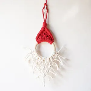 Handmade macrame Christmas hat wall hanging ornament Nordic boho cotton rope holiday decor.