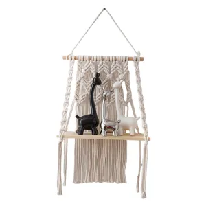 Bohemian woven macrame wall hanging shelf with wood board and ceramic animal decor for home.