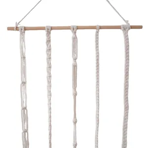 Macrame hair clip holder wall hanging woven hair bow organizer for girls room decor.