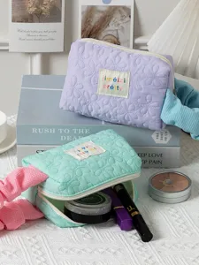 Quilted cosmetic bag with cute floral pattern, candy color makeup pouch with handle and zipper.
