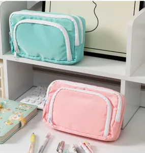 Detail view of multi-layer canvas pencil pouch desktop storage aesthetic stationery box close up