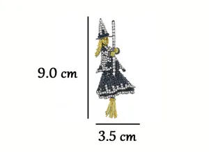 Detailed view of the rhinestone witch brooch, featuring sparkling black crystals and fine metal craft.