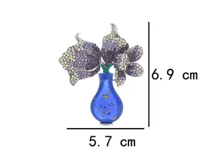 Detail view of the elegant full crystal tulip flower vase brooch, luxury coat pin accessory.