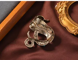 Vintage cobra brooch with turquoise accents, retro snake pin and pendant for women's coats.
