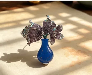 Close-up of a sparkling crystal tulip vase brooch detail showcasing exquisite craftsmanship.