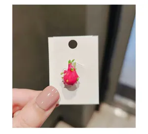 Miniature dragon fruit brooch detail, glazed enamel fruit lapel pin, cute fashion accessory.
