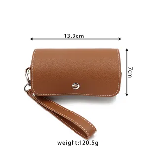 Compact PU leather pill case detail view, portable size 13.3x7cm with wrist strap.
