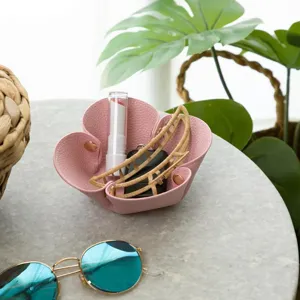Detail shot of the pink folding flower storage tray, ideal for organizing desk items neatly.