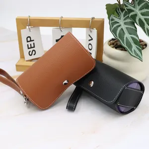 Detailed view of the portable leather pill box, showing dual compartments and PU material organizer.