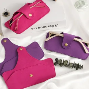 Detailed view of minimalist felt glasses case with snap button, soft portable sunglasses pouch.