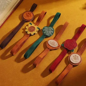 PU leather elastic book bands with cute flower and animal charm designs for reading.