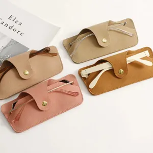 Minimalist PU leather glasses pouch set with snap button for travel and daily storage detail.