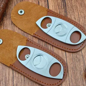 Stainless steel double blade cigar cutter with brown PU leather protective pouch detail view.