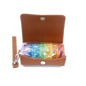 Detail view of brown PU leather weekly pill box with colorful compartments and portable hand strap.