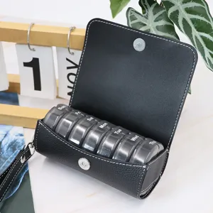 Portable 7-day pill organizer with black PU leather case, travel weekly pill box storage.