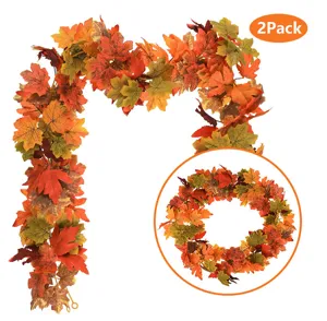 Detail showing two packs of autumn artificial maple leaf garlands for home decoration.