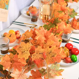 Realistic artificial autumn maple leaf garland displayed for dining table decoration