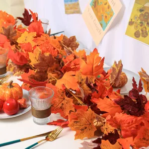 Macro detail view of realistic artificial autumn maple leaf garland for festive home decor