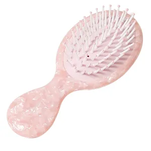 Elegante spazzola per capelli rosa effetto marmo con cuscino d'aria per massaggio
