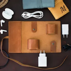 Retro PU leather electronics organizer roll bag for portable travel data cables and chargers.