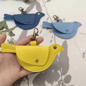 Leather bird shaped mini coin purse keychain, cute animal charm handbag pendant for women.