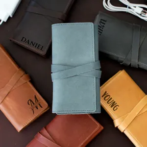 Details of retro PU leather electronics organizer roll bag for cables, chargers and mouse storage.