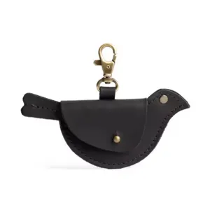 Close-up detail of the cute black leather bird shaped coin purse keychain pendant accessory.