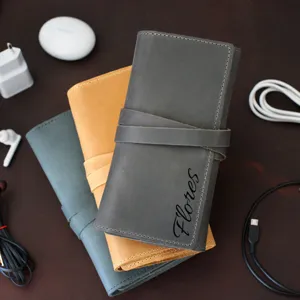 Minimalist vintage PU leather cord organizer roll bag, portable cable storage bag detail view.