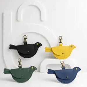 Mini bird shape leather coin purse detail, cute keychain pendant with metal snap hook.