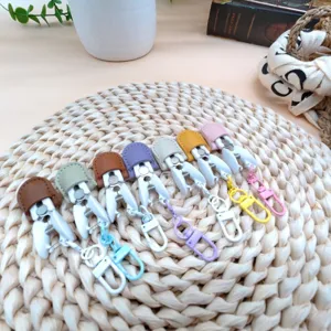 Colorful mini clips with leather top and keychain hooks, neat display for daily use.