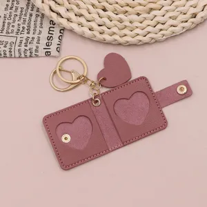 Mini leather photo keychain with heart window, cute couple picture holder pendant for keys and bags.