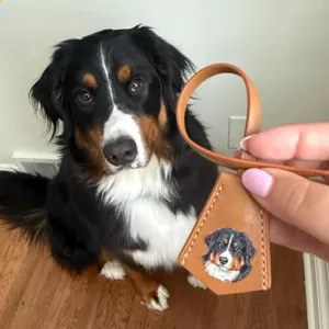 Personalized hand-painted pet dog leather luggage tag bag charm with custom animal portrait design.