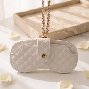 White quilted glasses case with gold chain strap, portable luxury sunglasses storage pouch.