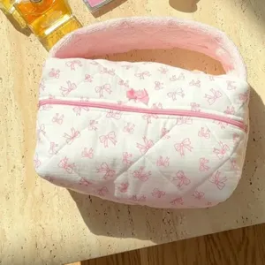 Towel cloth cosmetic bag with cute pink bow pattern, portable large capacity toiletry organizer.