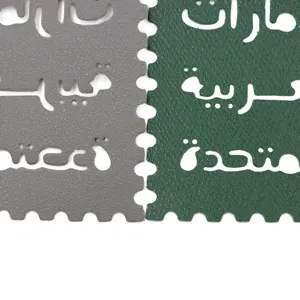 Detailed view of UAE style irregular letter bag charm with Arabic cut-out text.