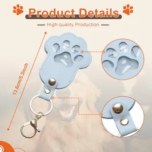 Blue PU leather pet paw memorial keychain with transparent photo window and metal ring.