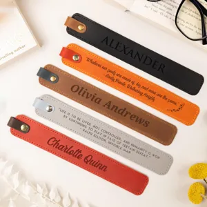 Close-up detail of customized PU leather bookmark with laser engraved text and snap button.