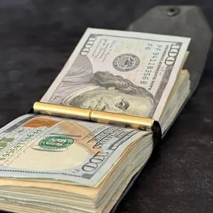Leather cash wrap wallet with secure magnetic closure and metal money clip, ideal for daily use.