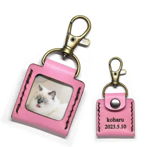 Custom pink leather photo album keychain with antique bronze clasp, personalized mini pendant.