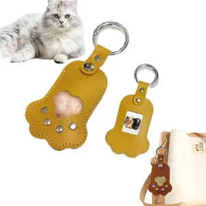 Cute cat paw PU leather pet fur storage bag and photo keychain, portable pet memorial charm.