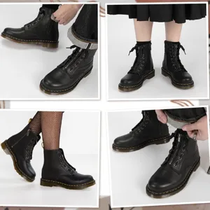 Detail view of black PU leather 8-hole boots with front zipper insert and yellow stitching.