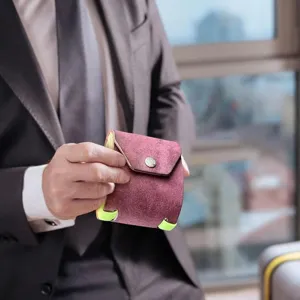 Compact leather wrap wallet featuring secure magnetic closure and stylish neon accent bands.