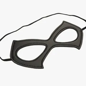 Close-up of black PU leather superhero eye mask detail, smooth texture with elastic strap.