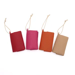 Mini bolso colgante de cuero PU para pañuelos, estuche de pañuelos de color solido para uso diario.