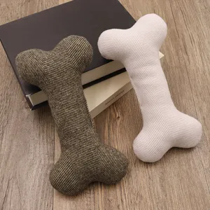 Cute bone-shaped pet dog toy durable plush chew toy for small dogs interactive play.