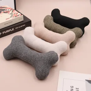 Close-up detail of soft knit bone-shaped pet toy, textured fabric for interactive dogs.