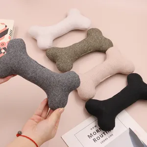 Cute bone-shaped plush pet dog toy, durable cotton chew toy for small and medium dogs.