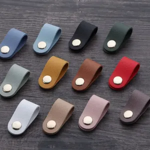 Colorful PU leather cord organizer detail, metal snap button for neat headphone cable storage.