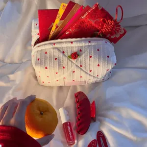 Quilted cosmetic makeup bag with cute red heart pattern and sweet rose detail for daily storage.