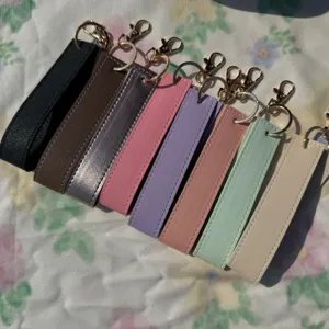 Set of colorful PU leather wristlet keychains with gold-tone hardware, stylish and durable.